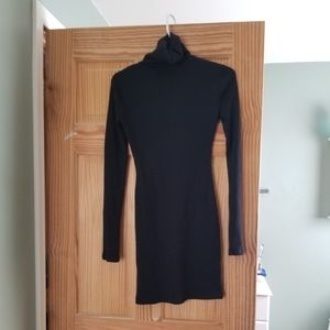 form fitting black turtle neck dress